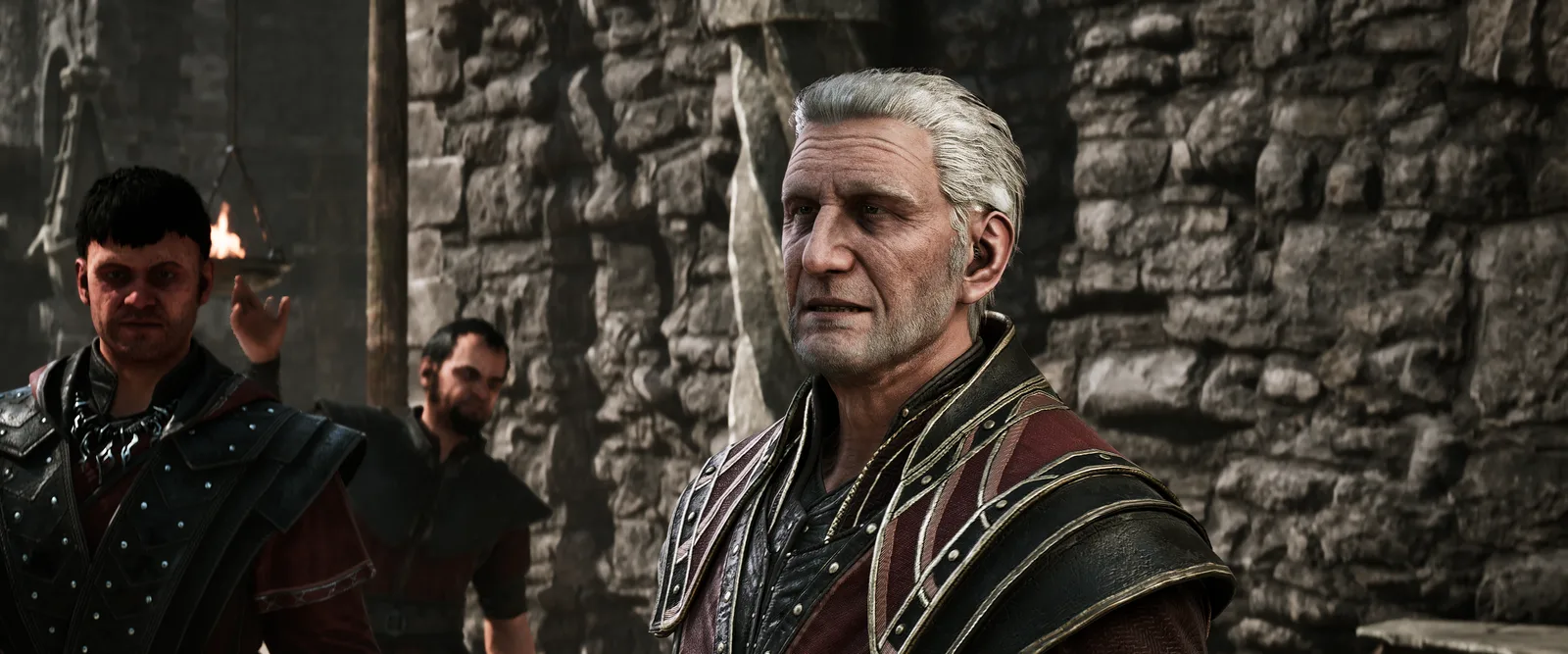 Corristo (right) with a younger mage in front of a stone wall, Gothic 1 Remake